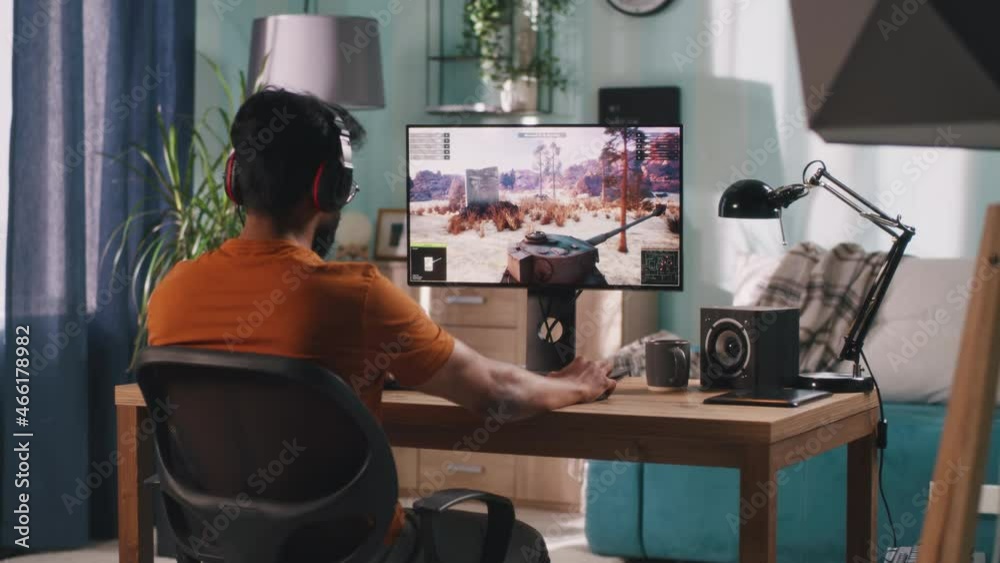 Man playing videogame on computer