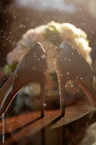 wedding rings and shoes of the bride