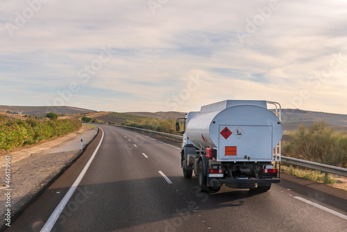 Truck with panels of dangerous goods for distribution of fuel for heating and small industries, circulating on the highway. photo
