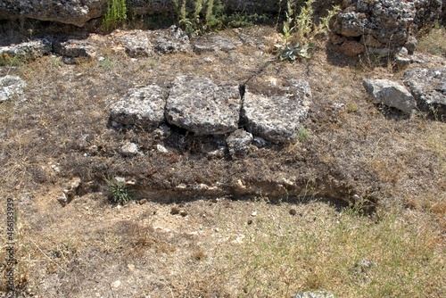 Anthropomorphic tombs excavated in rocky soil, oriented from east to west. Dating from the 10th century, located in the medieval necropolis next to the Mozarabic hermitage of San Baudelio, Casillas de photo