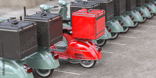 Red delivery scooter with delivery bag in a row of mopeds of grey color. Fast express delivery concept. photo