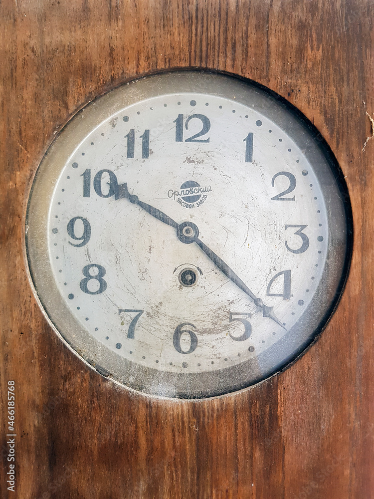 Retro mechanical wall old clock with a pendulum. Old retro wall clock Retro mechanical wall old clock with a pendulum. Old retro wall clock