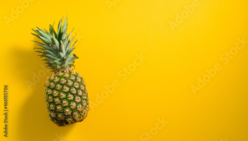 Pineapple on yellow background 