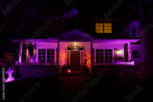 Halloween night lights decorating house with cemetery theme