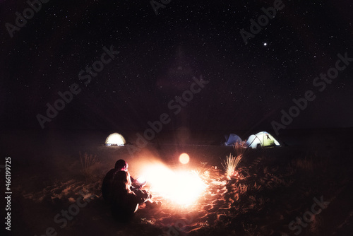 People and fire at night on the beach, Ukraine