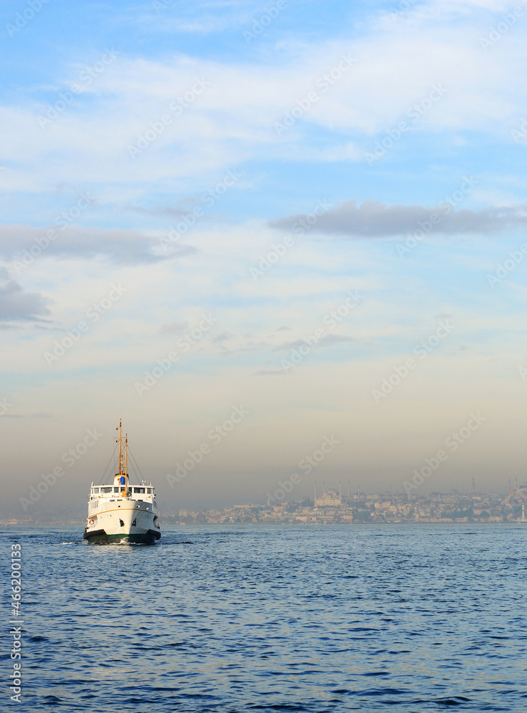 White ship in the İstanbul Bosphorus, background with İstanbul city.