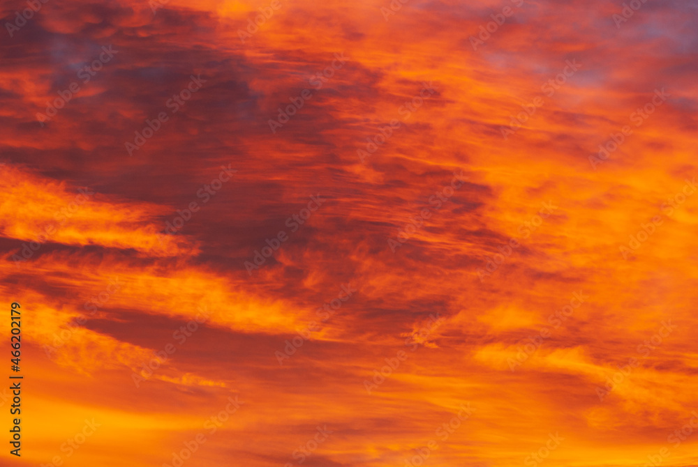 A beautiful fascinated red like fire cloudscape before sunrise in autumn