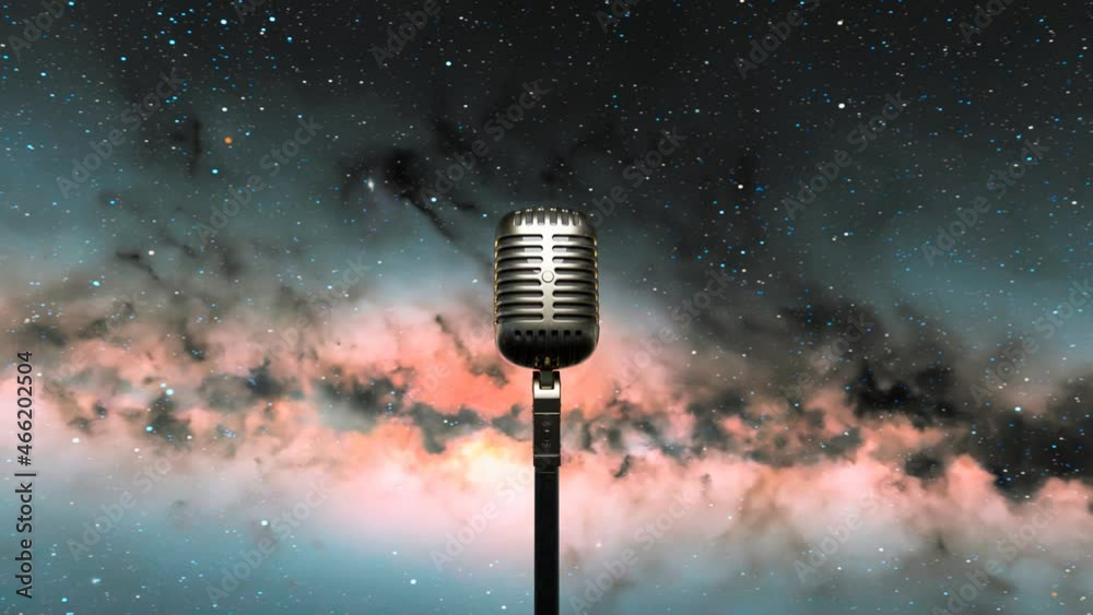 The shiny vintage microphone with the starry night sky in the background.