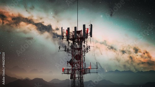 Camera spin around an antenna complex on a hill. Starry night in the mountains.