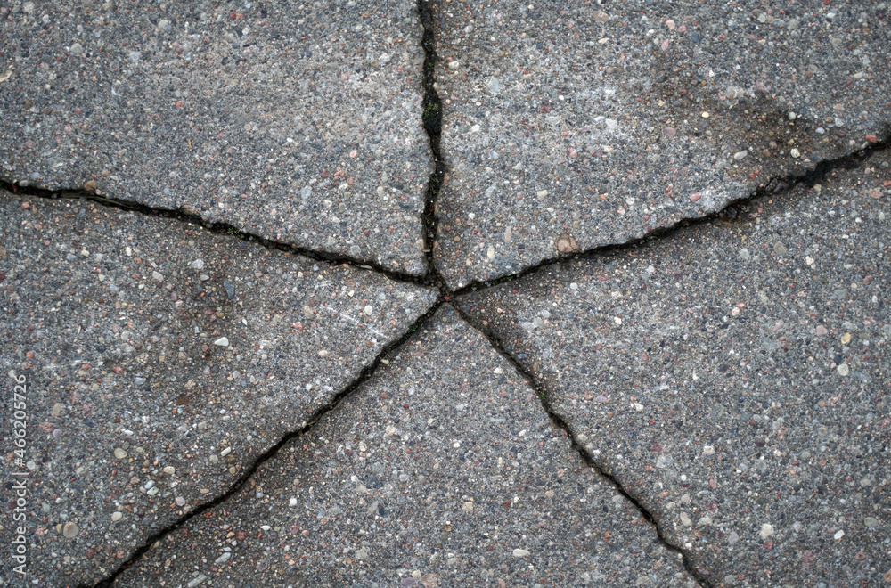 Obraz premium Cracked asphalt texture. View from above. Close-up