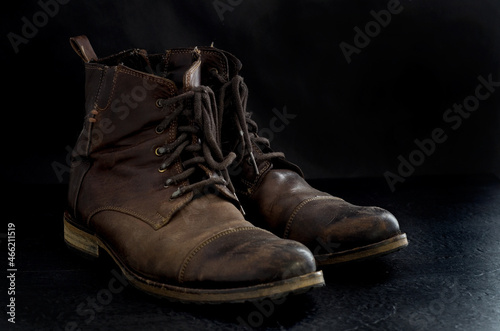 Side View of Old Dusty Brown Leather Boots