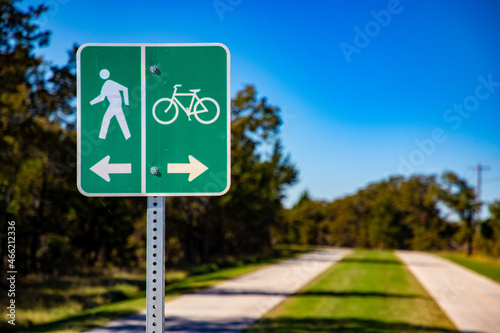 Green Sign With Arrows For Pedestrians and Bicycles