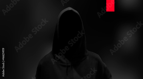 Silhouette of a hacker on black background, hacking of a computer system, theft of data concept