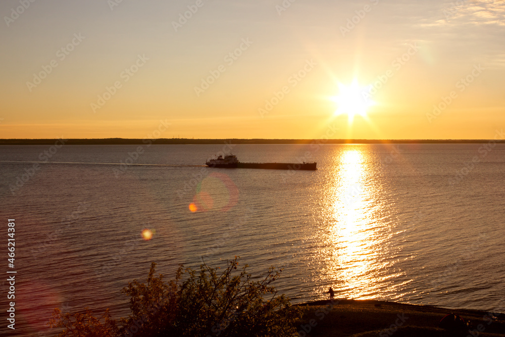 summer dawn on the Volga river and a ship sailing in the sun summer dawn on the Volga river and a ship sailing in the sun