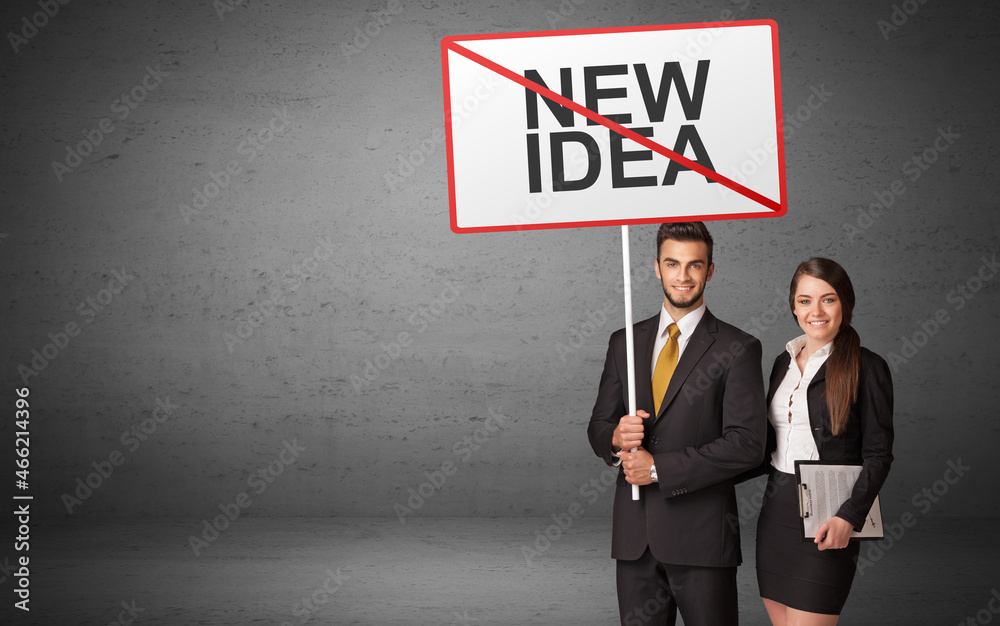 business person holding a traffic sign business person holding a traffic sign