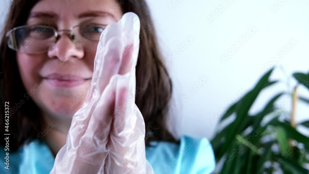 close-up of medical gloves on female hands, a doctor, a nurse preparing to vaccinate, treating patient's wound, concept of compulsory vaccination against coronavirus covid 19 close-up of medical gloves on female hands, a doctor, a nurse preparing to vaccinate, treating patient's wound, concept of compulsory vaccination against coronavirus covid 19