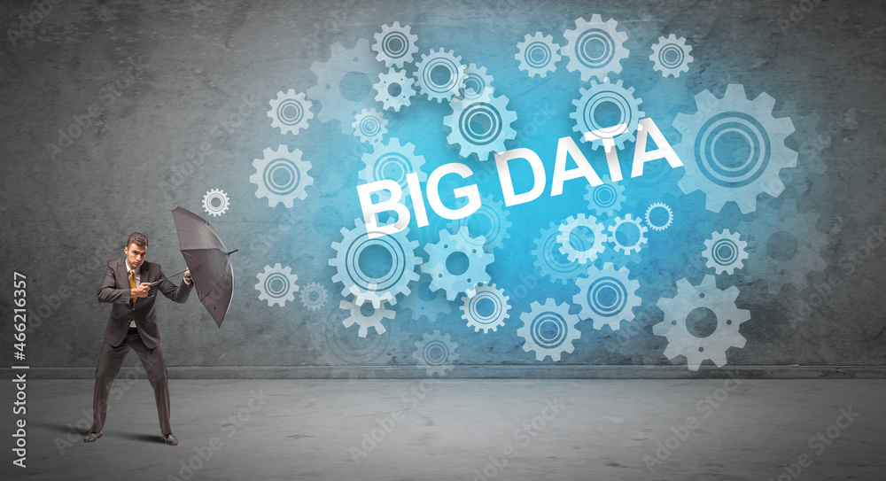 Fototapeta premium Businessman defending with umbrella concept