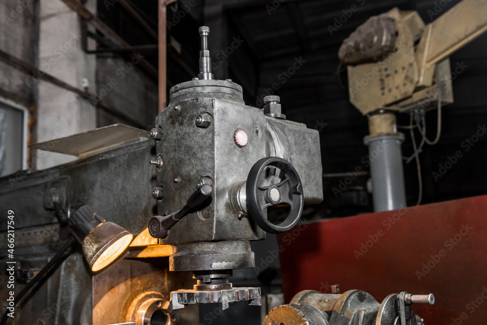 Part of the old equipment for metal processing milling machine at an industrial enterprise in the working shop Part of the old equipment for metal processing milling machine at an industrial enterprise in the working shop