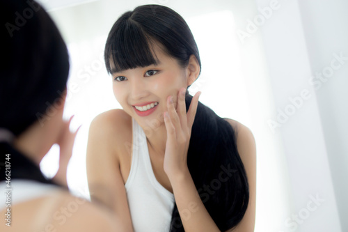 Beautiful face of young asian woman with happy smiling and touch cheek looking mirror with charming, makeup of beauty facial girl with skincare and cosmetic treatment, skin care and healthy concept. Free Download Beautiful face of young asian woman with happy smiling and touch cheek looking mirror with charming, makeup of beauty facial girl with skincare and cosmetic treatment, skin care and healthy concept. - GFXLoad