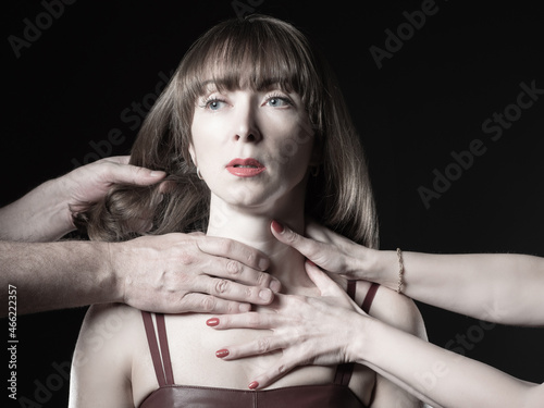 Many hands on woman neck. H...