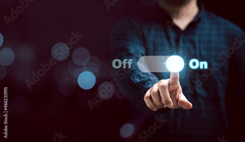 Photos Businessman touching to virtual toggle switch button for change from off to on