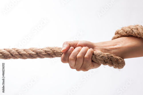 hand holding tight to a rope.