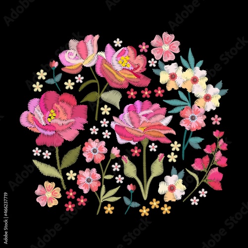 Round arrangement of beautiful embroidered flowers with pink and yellow petals on a black background. Magic vector illustration.