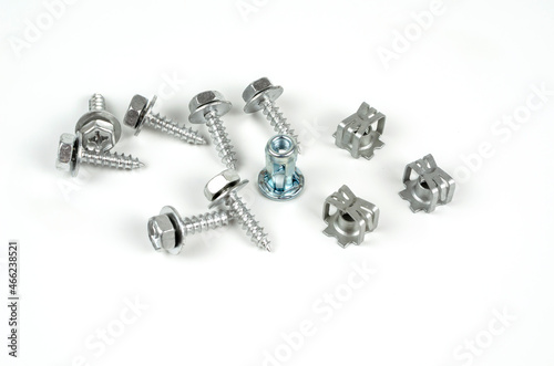 Turnkey fastening screws. Metal brackets for self-tapping screws. Close up. Isolated on white background