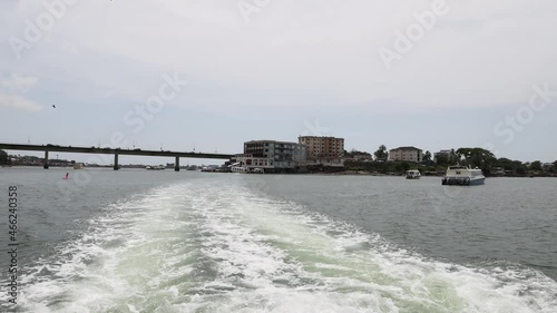 Ocean wake Freetown Sierra Leone ferry boat. Ferry boat from Freetown international airport to the main city. Lungi airport a long distant from city. Across the ocean bay. photo