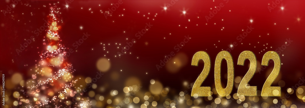 2022 new year on red background and abstract christmas trees in panoramic size