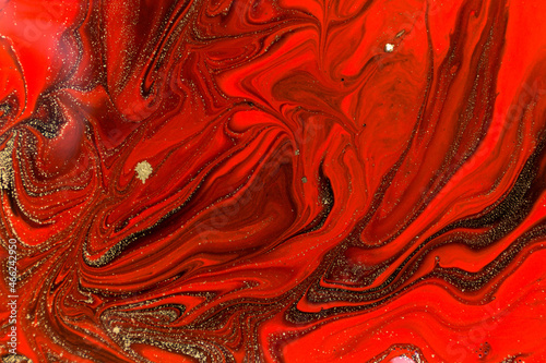 Red, black and gold marble fluid texture.