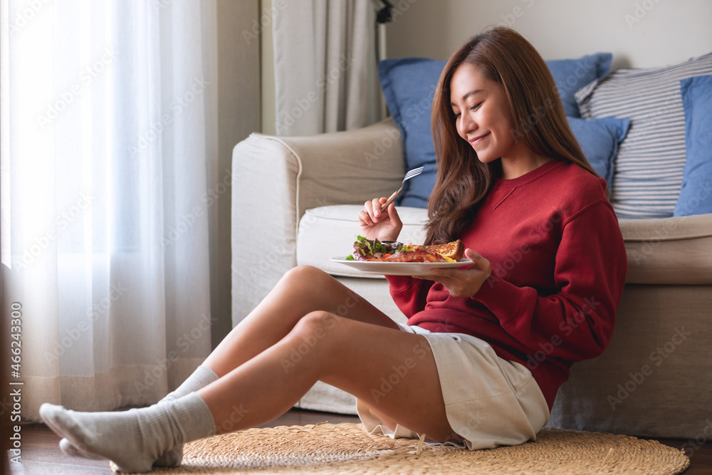 A young woman eating American breakfast at home A young woman eating American breakfast at home