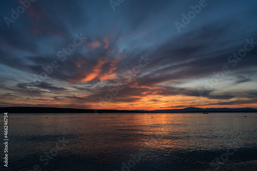 Panorama with a fisherman's boat in the afterglow over the Croatian coast. A summer scene. © Ralph