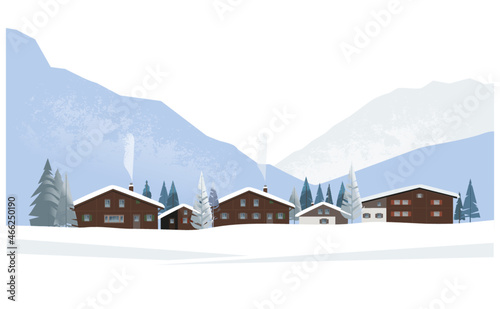 Winter mountain landscape. Traditional Alpine village with wooden houses in front of snow-capped mountains