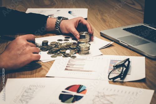 Money in Financial and Business market growth concept, There is money coins to stack of coins. Close up of coins to stack of coins Saving money for retirement planning.