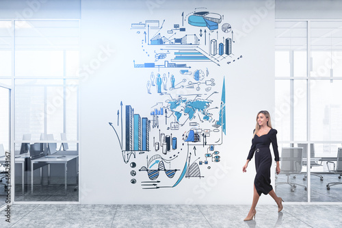 Businesswoman in black dress walking in office room, graph sketch on wall © ImageFlow