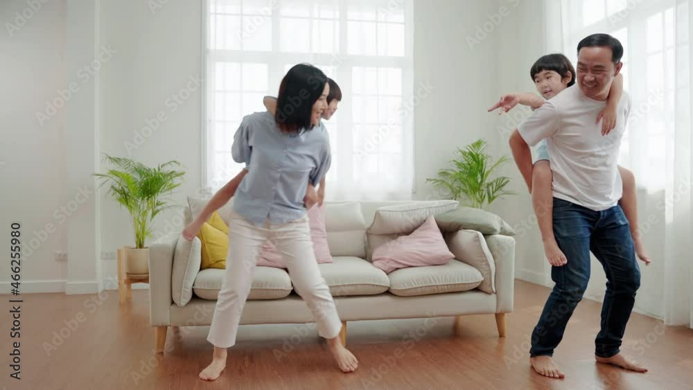 sian family relationships, father, mother and son are piggybacking for fun in their home.
sian family relationships, father, mother and son are piggybacking for fun in their home.