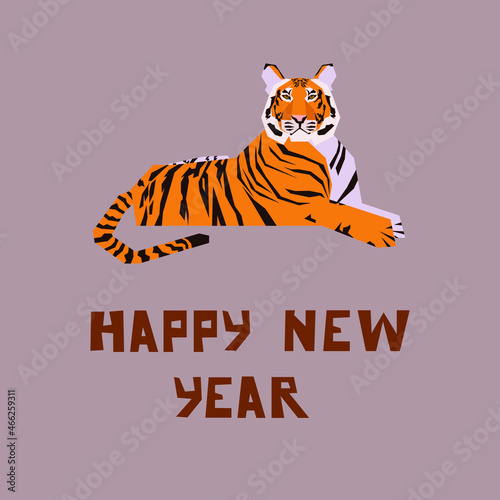 Happy new year lettering. Tiger on the background with Happy New Year. An adult orange tiger lies with a congratulation for the new year. © Victoriya