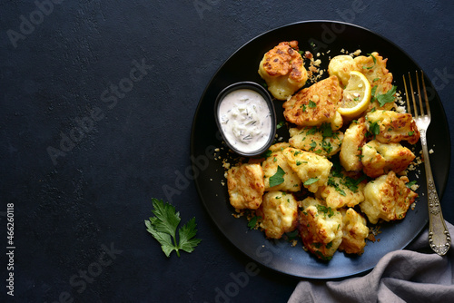 Roasted  spicy cauliflower with cheese and garlic crumbs. Top view with copy space.