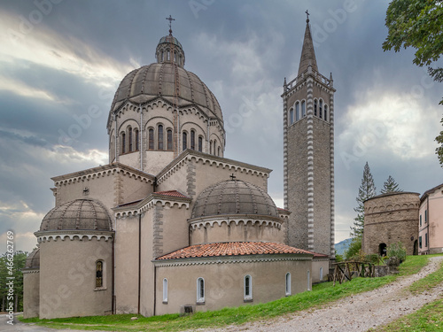 Parish Church of San Mamante and Delubro tower, Lizzano in Belvedere, Italy, under a dramatic sky photo