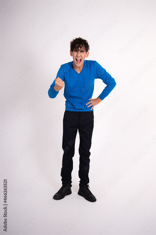Young funny student posing in the studio. Study and work. Young funny student posing in the studio. Study and work.