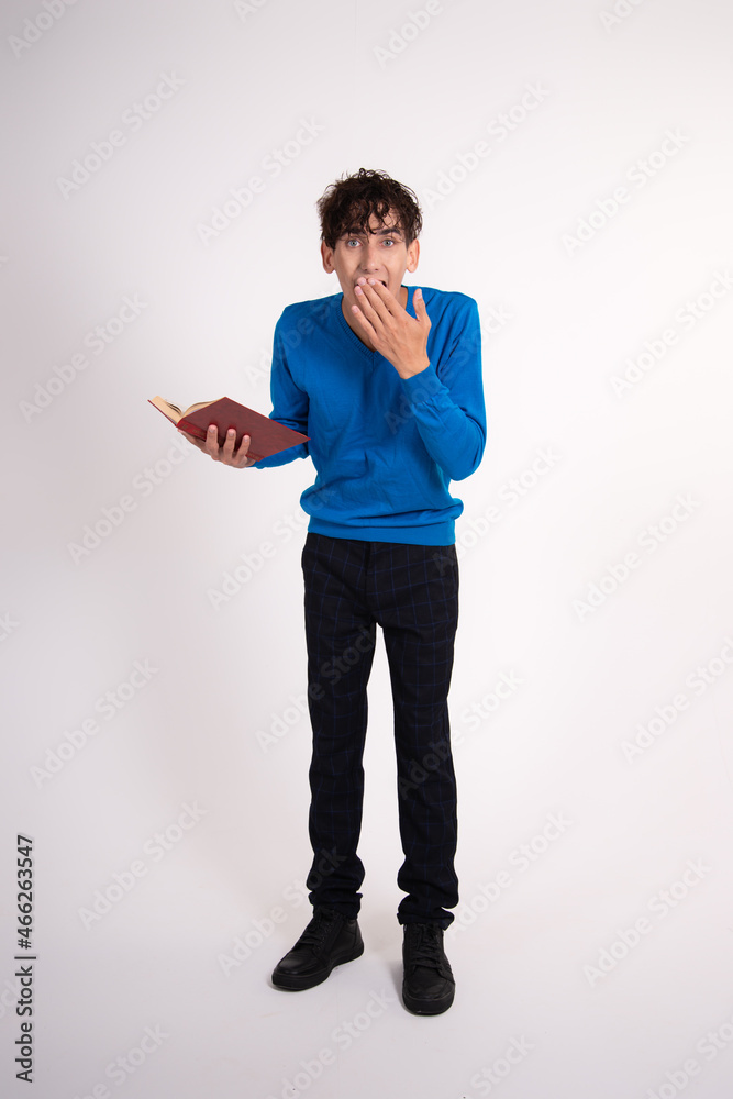 Young funny student posing in the studio. Study and work. Young funny student posing in the studio. Study and work.