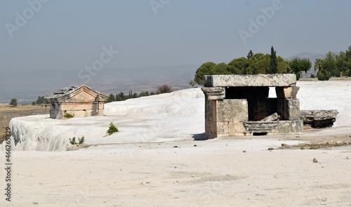 Tombs of sarcophagi on travertine Pamukkale. Ancient tombs.