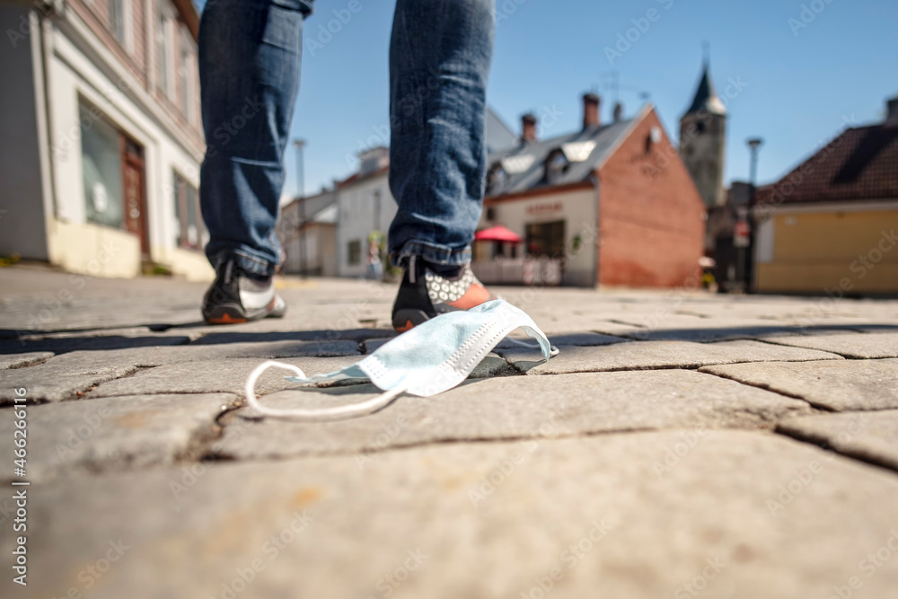 medical mask against coronavirus lying on the ground medical mask against coronavirus lying on the ground