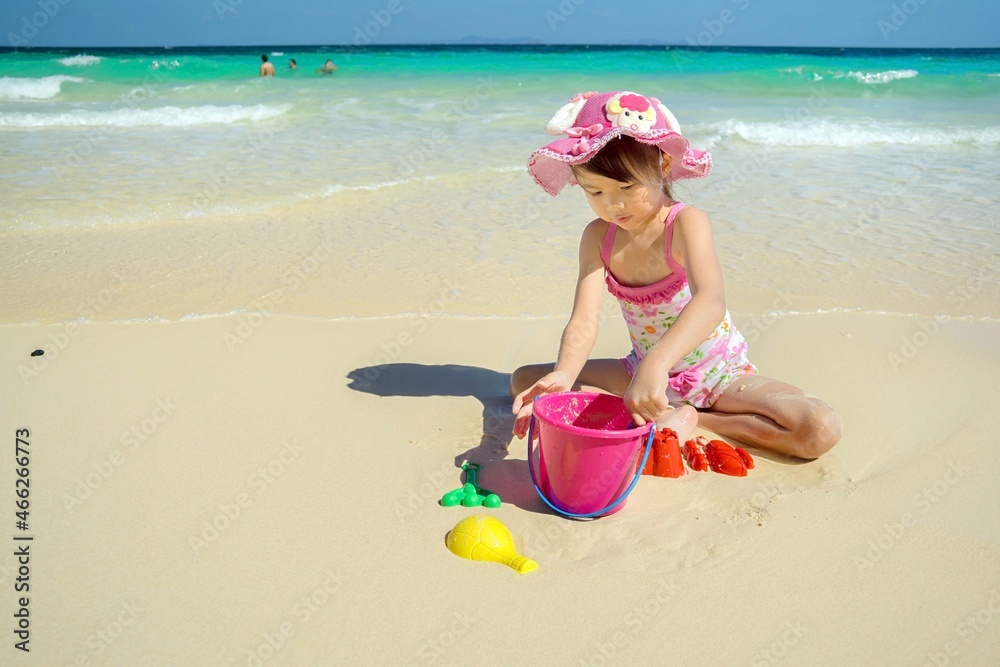 Cute girl is relaxing at the beach. Cute girl is relaxing at the beach.