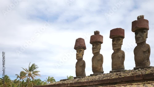 Moai statues in Anakena, Rapa Nui, Easter Island, Chile. The giant sculptures of Rapa Nui or Easter Island called Moai in Anakena beach.  photo