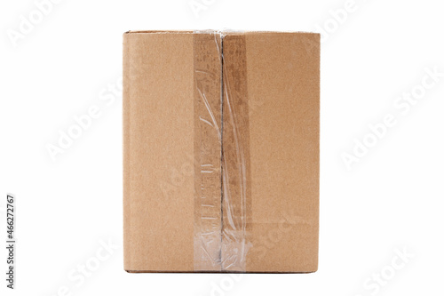 One single simple clear taped rectangle brown carton box parcel, blank closed package isolated on white background cut out, nobody. Product shipping, delivery equipment, post, mail service container