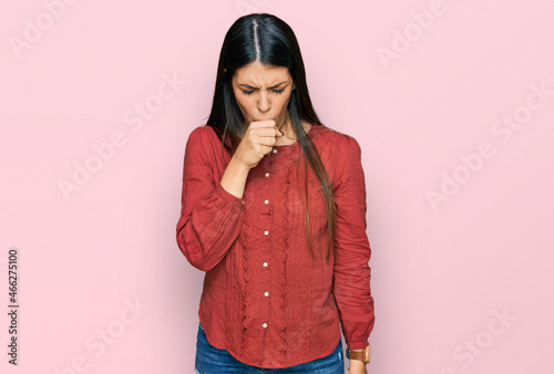 Young hispanic woman wearing casual clothes feeling unwell and coughing as symptom for cold or bronchitis. health care concept. © Krakenimages.com