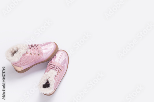 Fashionable children's pink shoes on a white background. Top view, flat lay.