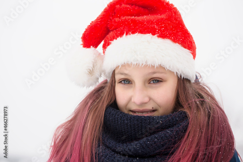 girl with pink hair in a santa